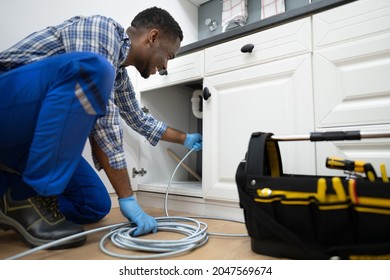 Plumber Drain Cleaning Services In Kitchen. Unclog Blocked Pipe