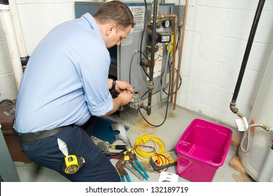 Plumber Fixing Gas Furnace