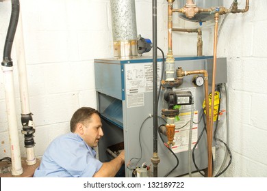 Plumber Fixing Gas Furnace