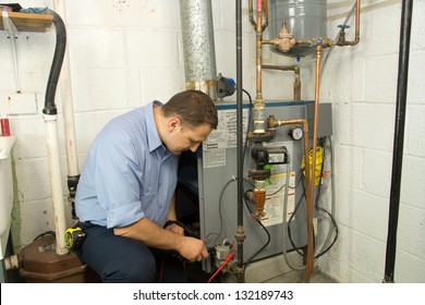 Plumber Fixing Gas Furnace