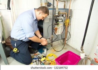 Plumber Fixing Gas Furnace