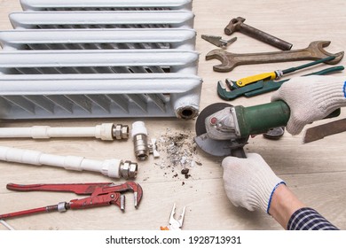 Plumber Hands Repairing Valve Of Broken Radiator Central Heating With Angle Grinder