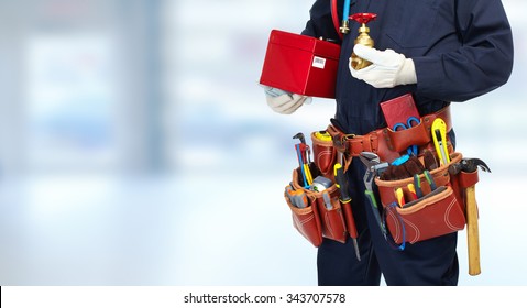 Plumber Hands With Water Tap Over Blue Banner Background.