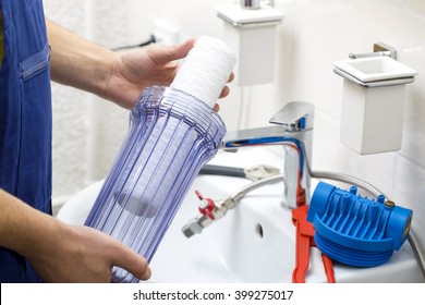 Plumber Installing New Water Filtration System