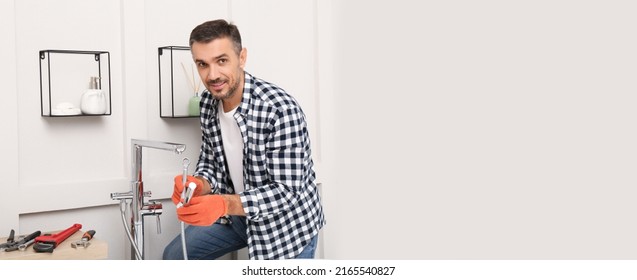 Plumber Installing New Water Tap In Bathroom, Space For Text. Banner Design