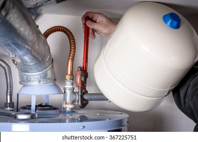 Plumber Installs A Compression Tank On A Hot Water Heater