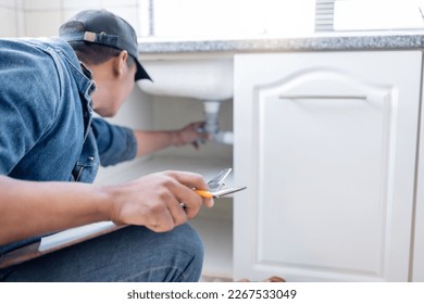 Plumber man, technician and clipboard document for pipeline, home renovation and quality assurance notes. Handyman, plumbing service and checklist in house for building, engineering and inspection - Shutterstock ID 2267533049