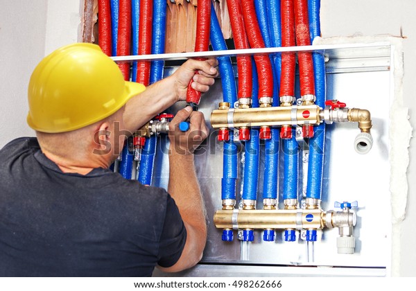 Plumber mounted distributor of\
central heating. Pipe fittings Central Heating\
Distributor.
