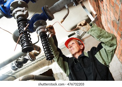 Plumber Technician Works With Water Pump