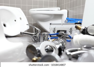 Plumber Tools And Equipment In A Bathroom, Plumbing Repair Service, Assemble And Install Concept