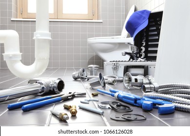 Plumber Tools And Equipment In A Bathroom, Plumbing Repair Service, Assemble And Install Concept