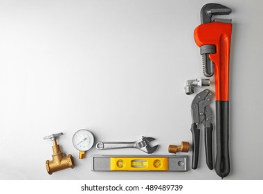 Plumber tools frame isolated on white
