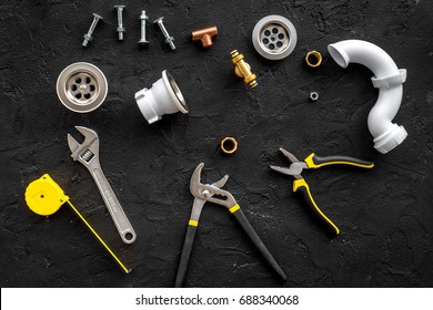 Plumber Tools On Black Background Top View