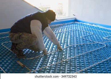 Plumber Working Installed System Radiant Floor