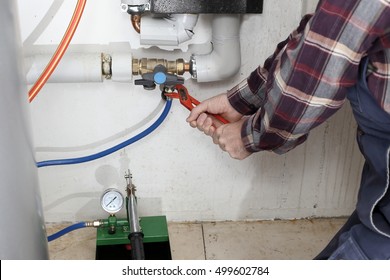 Plumber Is Working On A Heating System