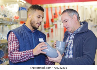 Plumbers Merchant With Worker