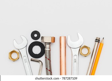 Plumbing Essential Tools On A Plain Background