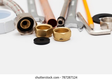 Plumbing Essential Tools On A Plain Background