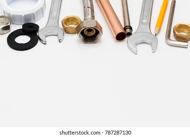 Plumbing Essential Tools On A Plain Background