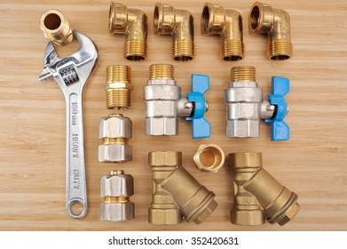 Plumbing Fittings On A Wooden Background