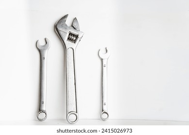 plumbing repair tool kit on white background, screwdriver, adjustable wrench, adjustable wrench, plumber's tool kit