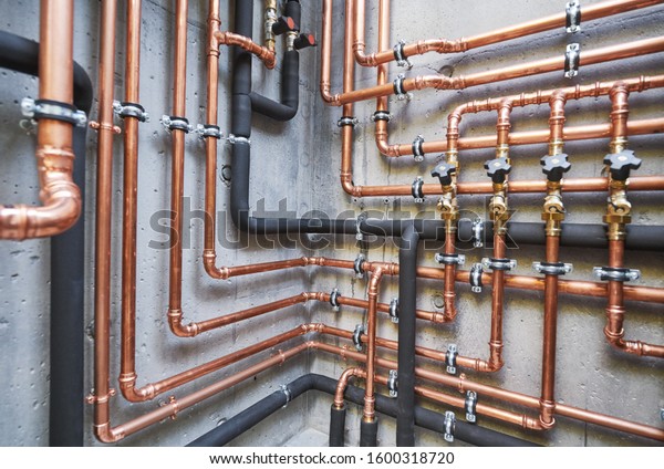 Plumbing service. copper pipeline of a heating\
system in boiler room