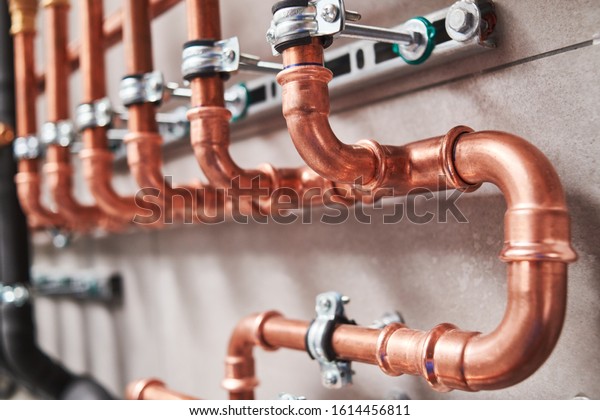 Plumbing service. copper pipeline of a heating\
system in boiler room