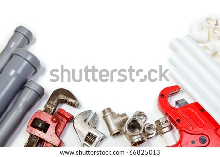 Plumbing tool pipes and fittings on white background
