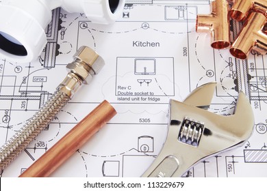 Plumbing Tools Arranged On House Plans