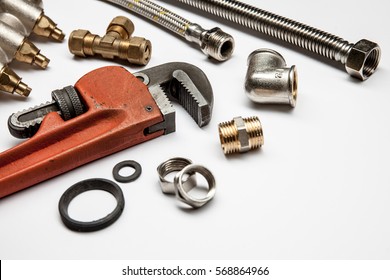 plumbing tools and equipment on white background with copy space