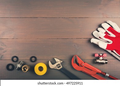 plumbing tools on wooden table with copy space