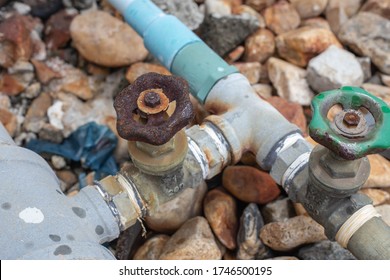 The Plumbing Valve Is Rusty.
Stone Background Was Blurred