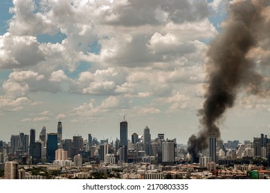 Plume Of Black Smoke Clouds From Burnt Building On Fire At Community Area In The Bangkok City. Fire Disaster Accident, No Focus, Specifically.