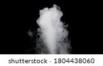 plume of smoke bubbling up against a black background.