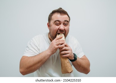 Plump Funny Man Eating Tasty Shawarma. Glutton