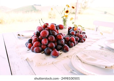 plums on white rustic table - Powered by Shutterstock