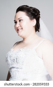 Plus Size Bride With Hairstyling And Makeup Studio Shot 