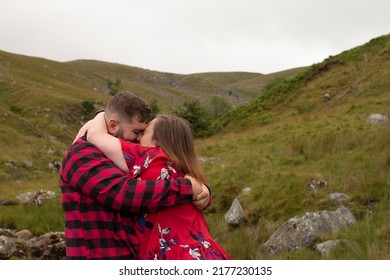 Plus Size Couple Outside On An Adventure Going In For A Kiss