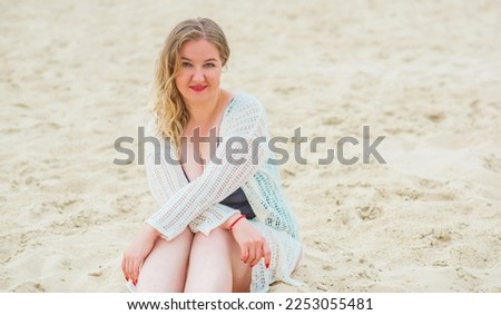 Plus size European blonde woman in stylish romantic women's summer clothes at beach. Concept of sizes, happy nice natural beautiful lady 
