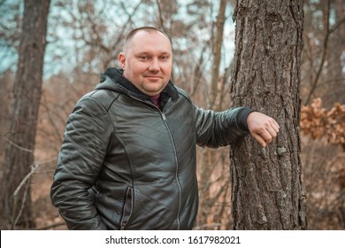 Plus size European man at forest, portrait of handsome man