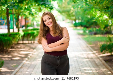 Plus Size Fashion Model In Casual Clothes, Overweight Female Body In A Park Outdoors.