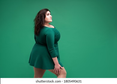 Plus Size Fashion Model In Green Dress, Fat Woman On Green Studio Background, Body Positive Concept