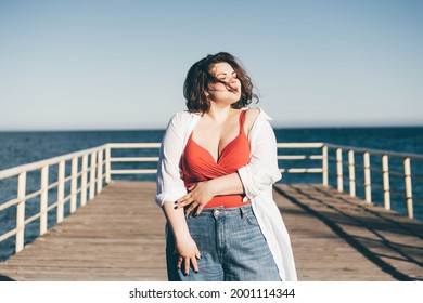 Plus Size Fashion Model In Red Bikini At Resort. 