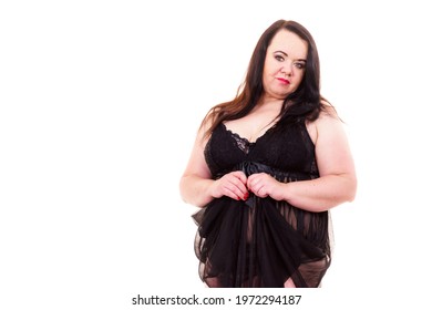 Plus size fat woman wearing black lace lingerie. Overweight voluptuous model in underwear set clothing on white