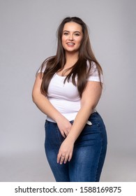 Plus Size Long Hair Woman Posing Like Model In Studio.