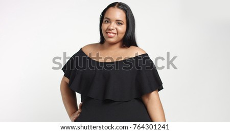 Plus size model in studio shoot happy smiling