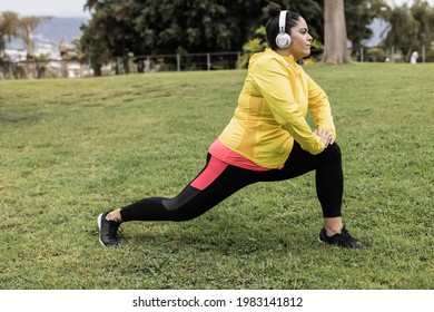 Plus Size Woman Doing Sport Workout Routine Outdoor In City Park - Focus On Face