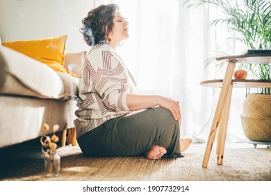  Plus Size Woman Doing Yoga And Meditation At Home.