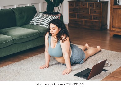  Plus Size Woman Doing Yoga And Meditation At Home.