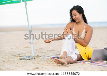 Plus size young woman sitting on tropical sand beach in summer. Holiday travel vacation.